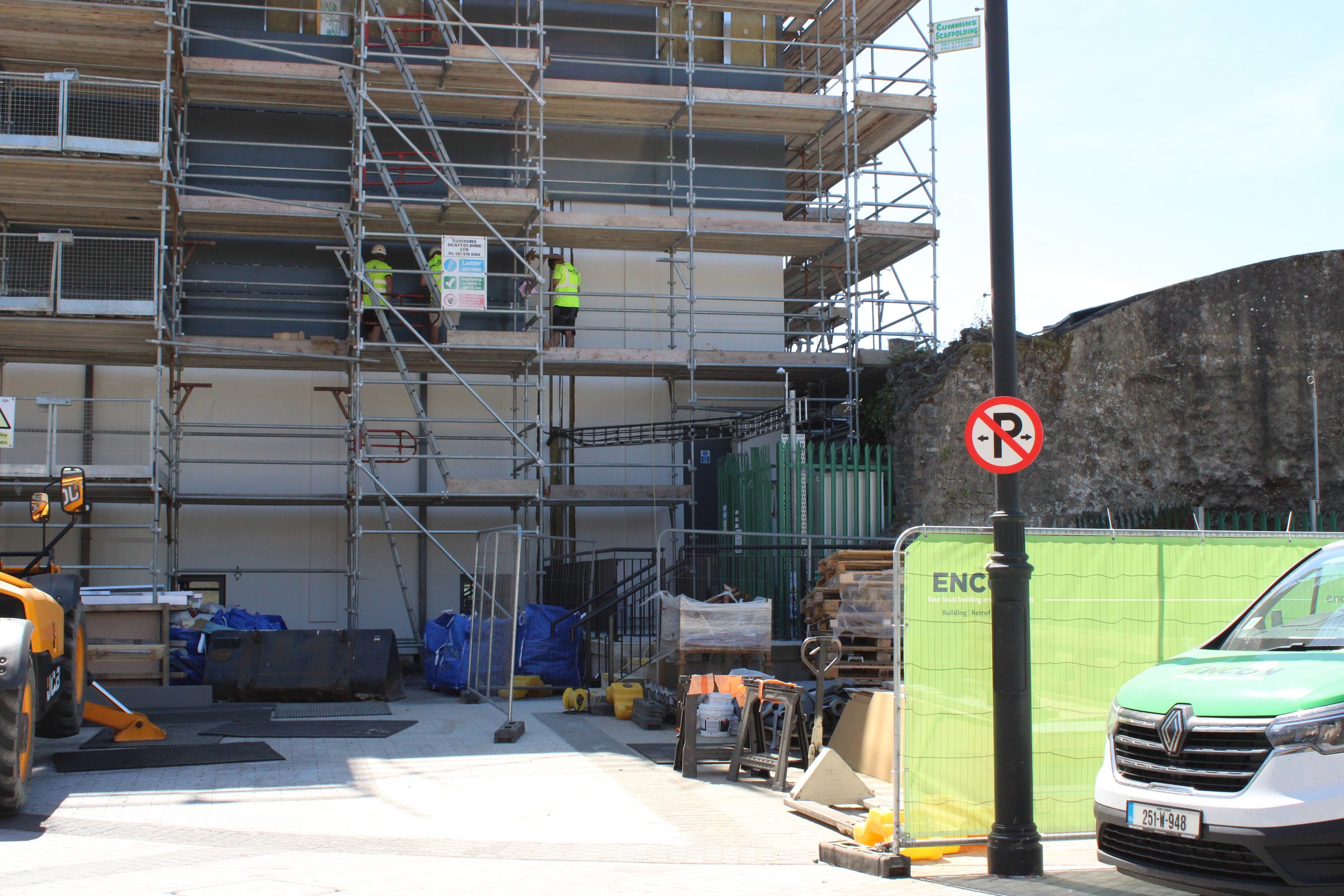 Scaffolded building with ENCON site hoarding