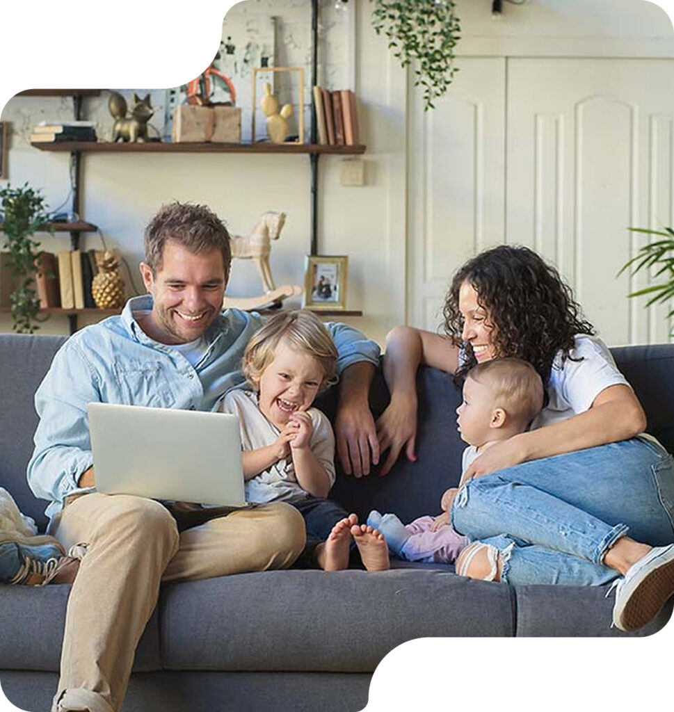 Family relaxing together on a sofa in a warm, well-insulated living room