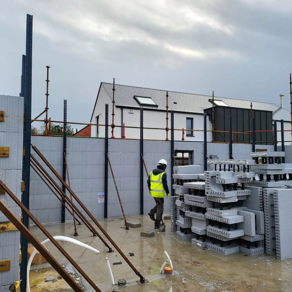Worker handling building materials on a construction site